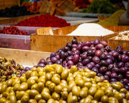 Person carrying groceries from a local market